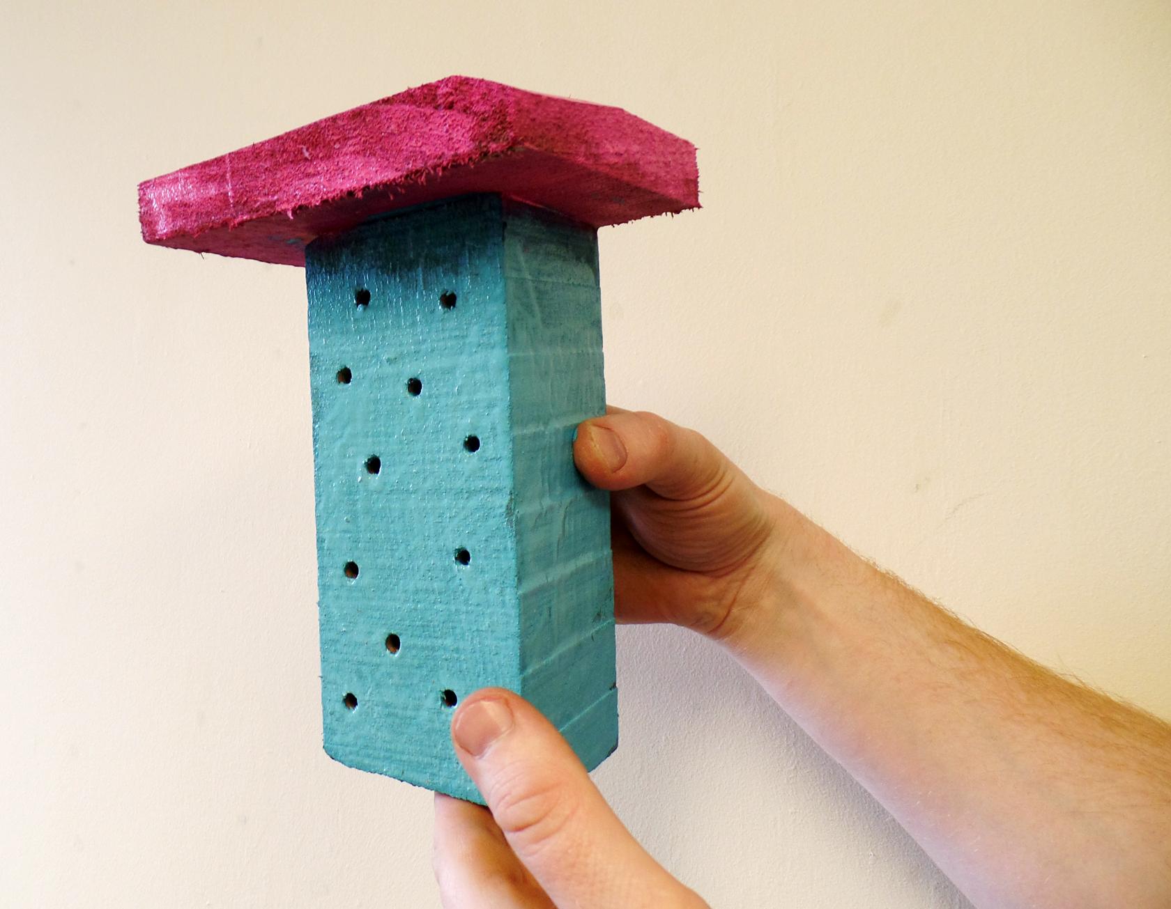 Home-made brightly painted bee house Home-made brightly painted bee house